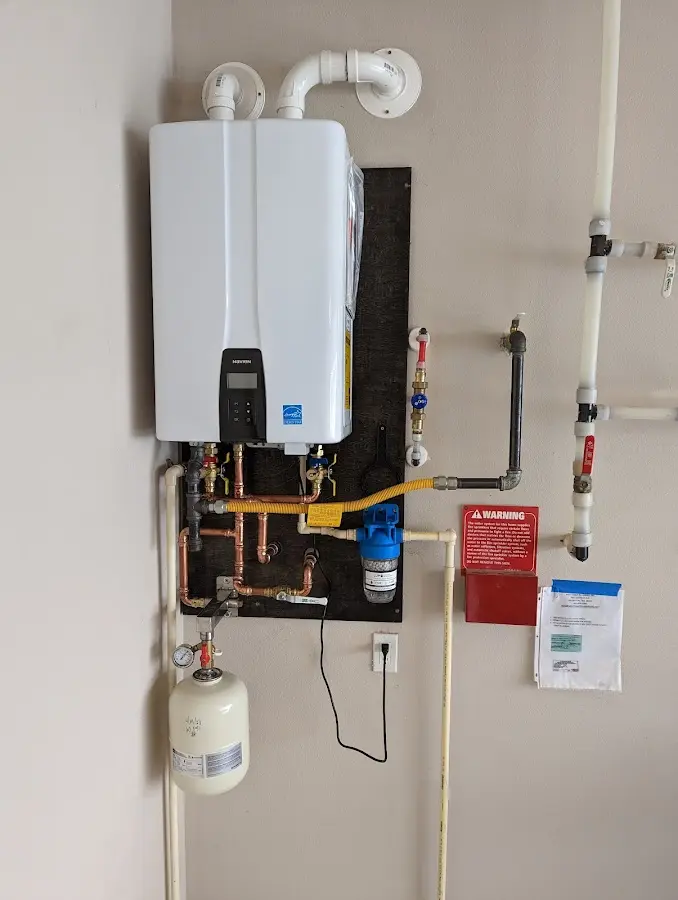 Professional plumber installing copper piping in a Capitol Heights home